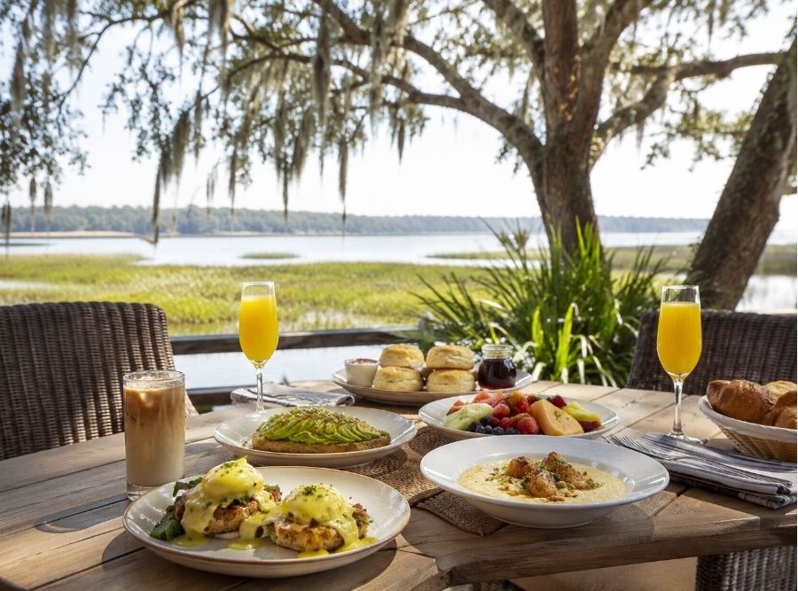 Luxury brunch spread on an outdoor patio overlooking the marsh on Hilton Head Island